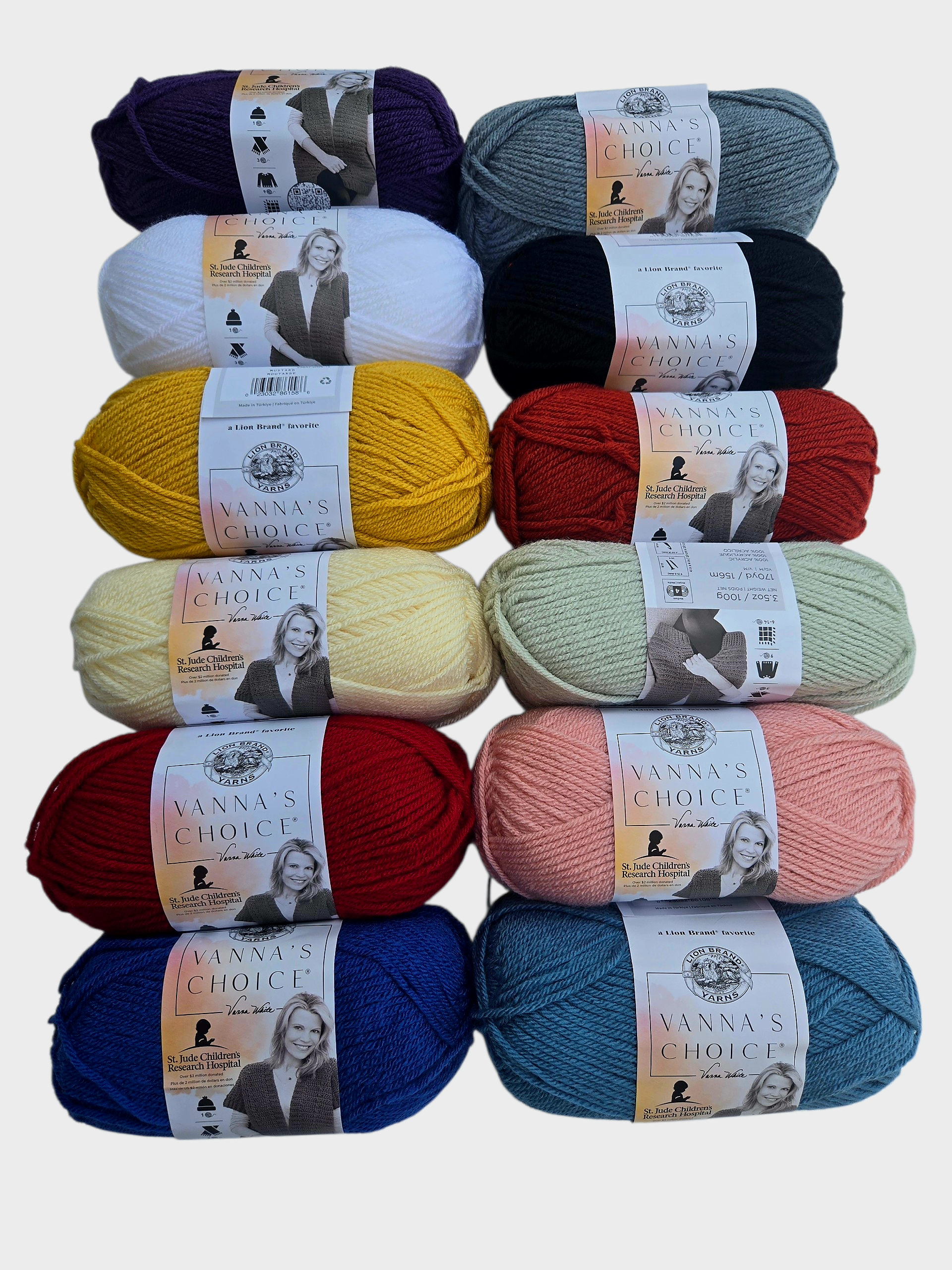 Assorted skeins of yarn in various colors with labels on a light gray background
