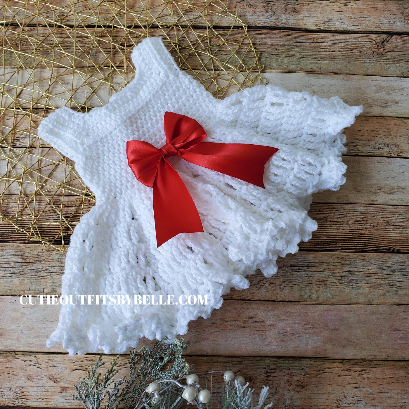 Crochet baby dress with red bow